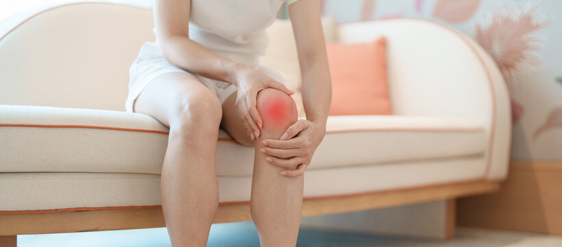 woman having knee ache and muscle pain due to Runners Knee or Patellofemoral Pain Syndrome, osteoarthritis, arthritis, rheumatism and Patellar Tendinitis. health and medical concept