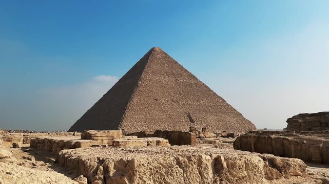 Great Pyramid Rising above Ancient Mastaba Tomb Ruins on the Giza Plateau Necropolis. Cinematic slider motion