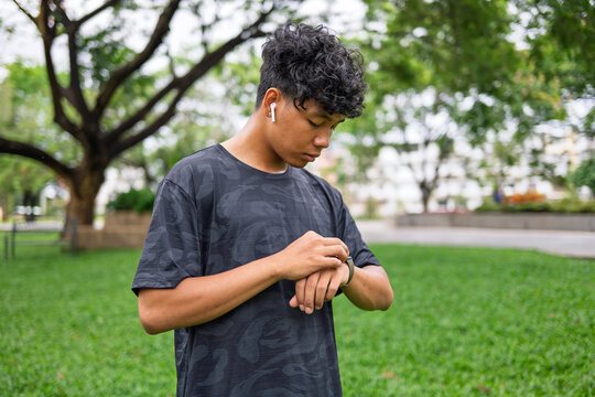 African American mixed race man using smartwatch for fitness tracking and healthy lifestyle.