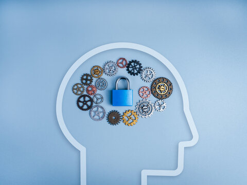 Human mind with gears and padlock symbolizing secure intelligence, protected information, cognitive security, AI safety, privacy protection, cybersecurity, trusted systems, and digital resilience.