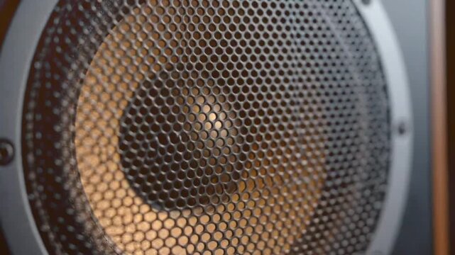 Close up shot of speaker cone vibrating with audio waves creating sound, audio equipment, dynamic motion, detailed texture, extreme macro photography capturing sound reproduction.