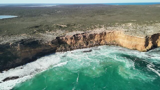 Ethel Beach, Dhilba Guuranda-Innes National Park, South Australia &ndash; 4K aerial drone view of sandy beach, dramatic limestone cliffs, turquoise ocean and rugged Yorke Peninsula coastline
