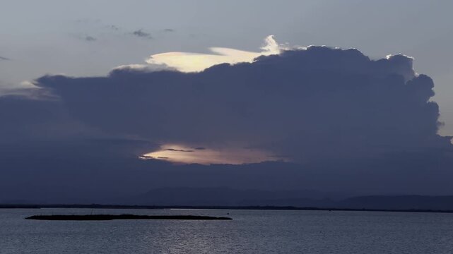 Dramatic Storm Clouds Over a Calm Lake
