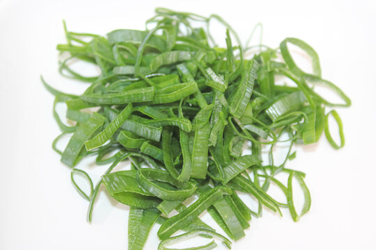 Fresh chopped green scallions isolated on white background photo