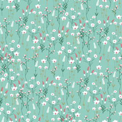 Delicate wildflowers on soft mint green seamless botanical pattern