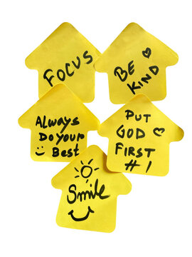 Five yellow house shaped sticky notes with handwritten inspirational quotes and positive messages
