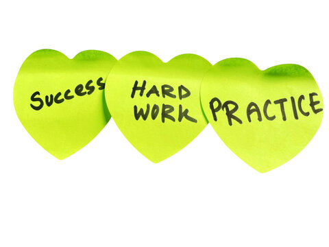 Three yellow heart shaped sticky notes with handwritten words success hard work and practice