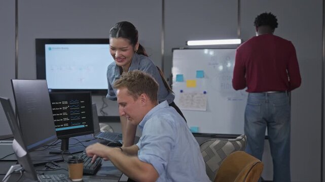 Team collaborates on project planning using AI-powered analytics dashboard, reviewing data visualizations and whiteboard with sticky notes for sprint workflow.