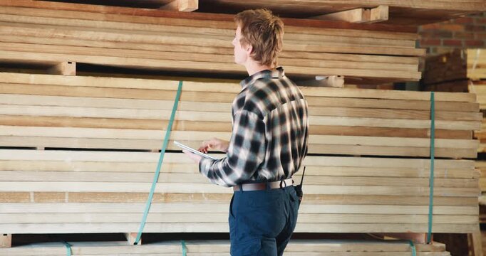 Workshop, inspection and carpenter on tablet for inventory, quality assurance and check material. Carpentry, factory and man on tech for woodworking, timber production and evaluation report for wood