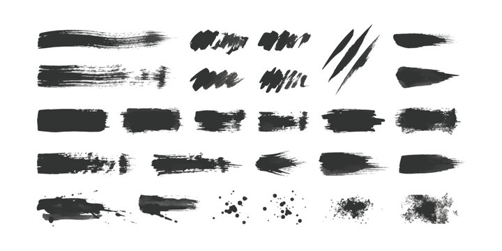Set of black ink brush strokes and paint splatters for artistic design elements