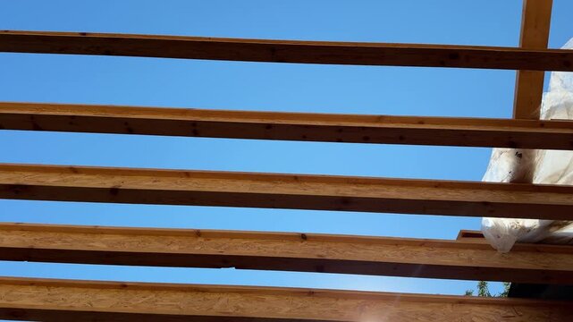 Construction of a Wooden Pergola Roof Over a Terrace