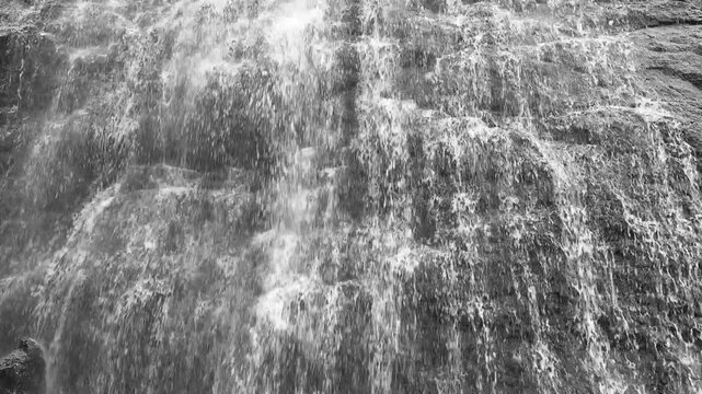 4K view of a breathtaking multi-step waterfall in the Sahyadri mountains at the peak of the monsoon
