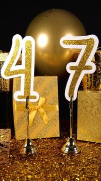 Gold Number 47 with Gold Glitter Confetti Sparkles with Gifts and Balloons for Party Forty Seven Vertical