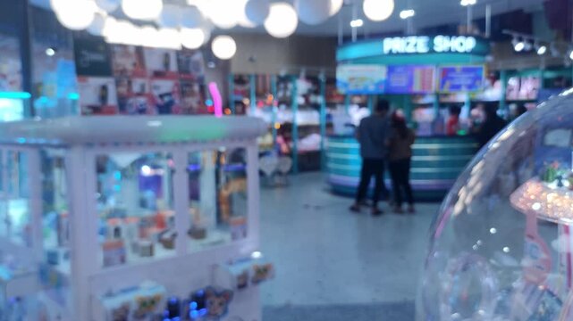 Blurred Defocused Arcade Game Center with Colorful Neon Lights and Claw Machines Background, Bokeh Entertainment Backdrop