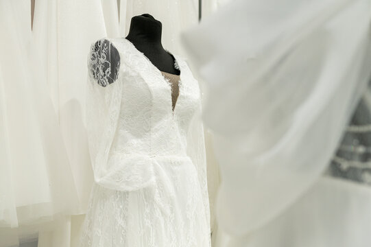 Elegant lace wedding dress display on mannequin