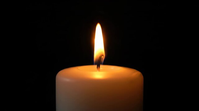 Close-up footage of burning candles, close-up of lit white candles