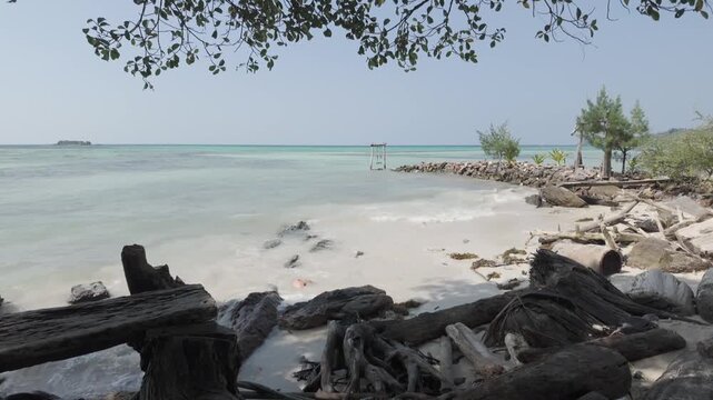 Peaceful Tropical Beach with White Sand and Gentle Waves at Bobby Beach Karimunjawa Indonesia