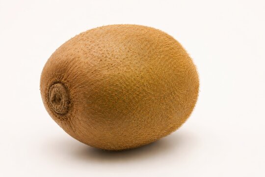 Whole kiwi fruit isolated on white background