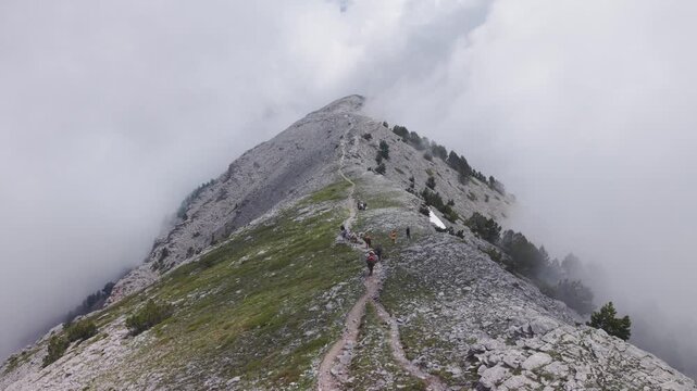 Aerial View of Pack Mules Ascending Rocky Ridge on Mount Olympus in Heavy Fog