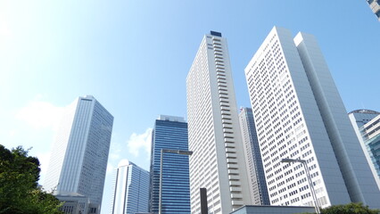 Fototapeta premium A photo looking up at the skyscrapers of Shinjuku, Tokyo, from below.