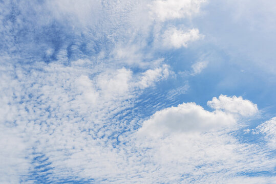 clear blue sky background,clouds with background, Blue sky background with tiny clouds. White fluffy clouds in the blue sky. 