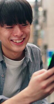 Texting, phone or university student in town with bicycle, online chat or comic post on commute. Laugh, happy and Asian man with bike travel, funny message or college meme on social media app.