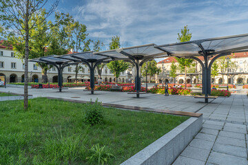 Old Market Square in Łódź with Modern Architecture and Blooming Flower Beds on a Sunny Day © Senatorek