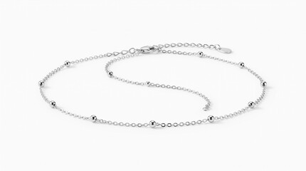 Fototapeta premium minimalist silver chain anklet isolated on clean background representing timeless jewelry, elegant fashion and everyday accessories concept