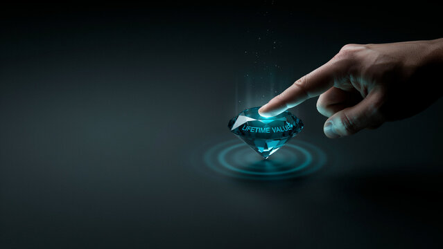 Human finger touching glowing digital diamond representing customer lifetime value concept business growth strategy