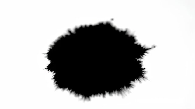 Close-up footage of black liquid dripping, ink dripping diffusion process