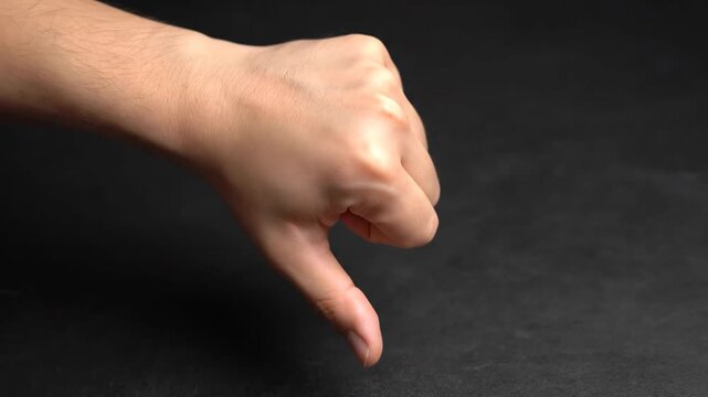 The hand thumbs down to express negative movements
