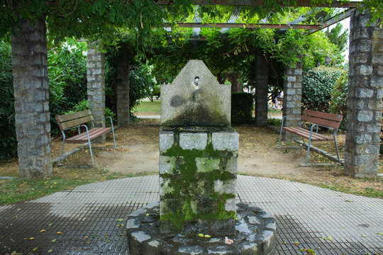 drinking fountain in the middle of the park