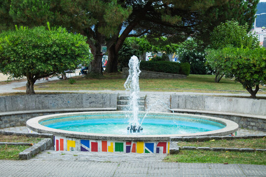 decorative fountain with jet in the middle of the park