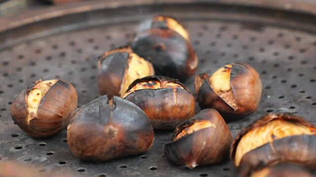 Roasting chestnuts on a street cart in the city
