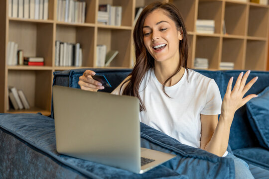 Young woman having a video call and looking joyful