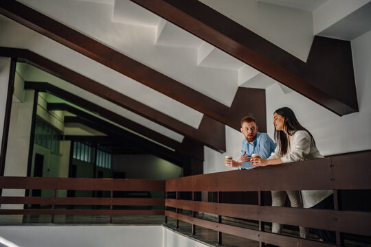 Business colleagues having coffee break conversation