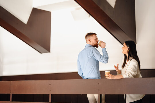 Business colleagues having coffee break conversation