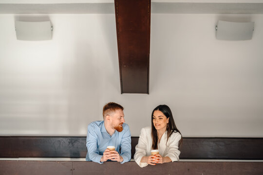 Colleagues having coffee break and casual conversation