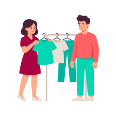 Fototapeta premium Couple choosing clothes from a garment rack in a store