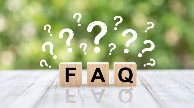 FAQ wooden blocks with floating question marks on a white table against a blurred green nature background  for customer service support help and frequently asked questions topics