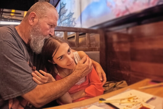 A man and a woman are sitting in a cafe