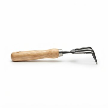 Handheld garden weeding tool with wooden handle. Manual cultivator fork for soil aeration and weed removal in organic gardening.