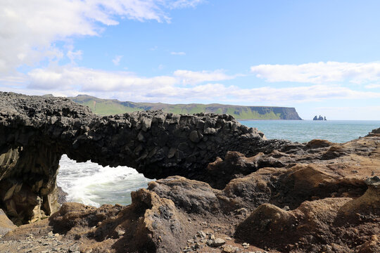 Rock arch on the Dyrh&oacute;laey peninsula &ndash; fantastic coastal landscape, Iceland