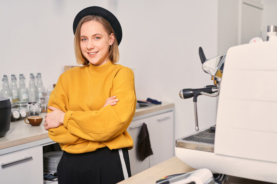 Female barista at her work place