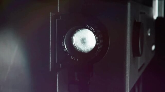 Macro Close Up of Vintage Film Projector Zoom Lens with Flashing Light Flares