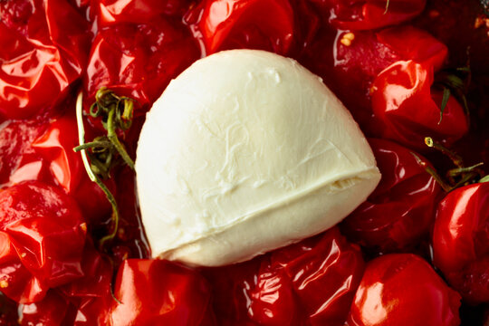 Mozzarella and roasted red cherry tomatoes.