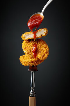 Nuggets with tomato sauce.