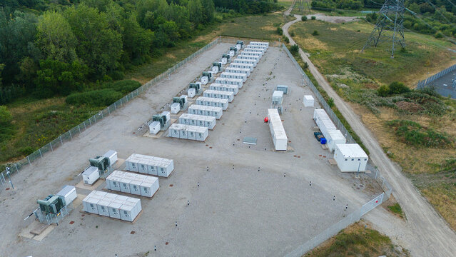 Aerial view close up of green lithium ion phosphate BESS battery units for grid resilience