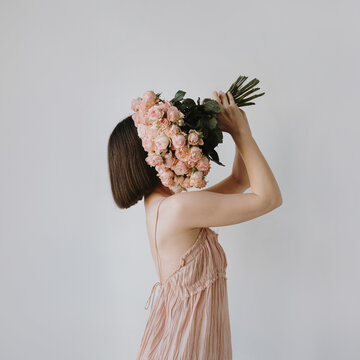 Woman Holding Pastel Roses Bouquet
