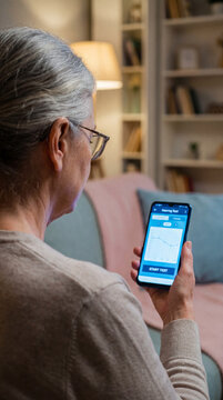 Senior woman using smartphone, Senior woman starting digital hearing test through smartphone application at home, authentic active aging concept showing value value value value value